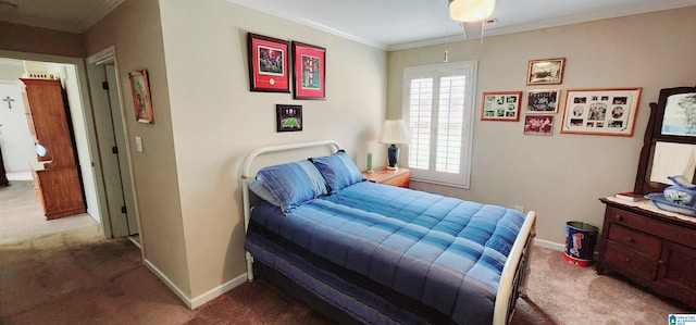 bedroom with crown molding and carpet floors