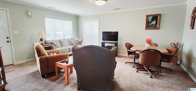 carpeted living room with ornamental molding