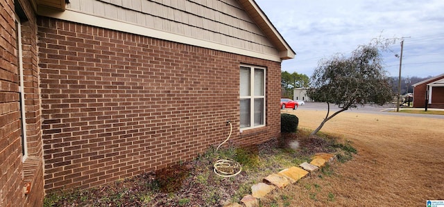 view of side of property featuring a yard