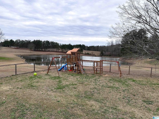 view of jungle gym featuring a water view