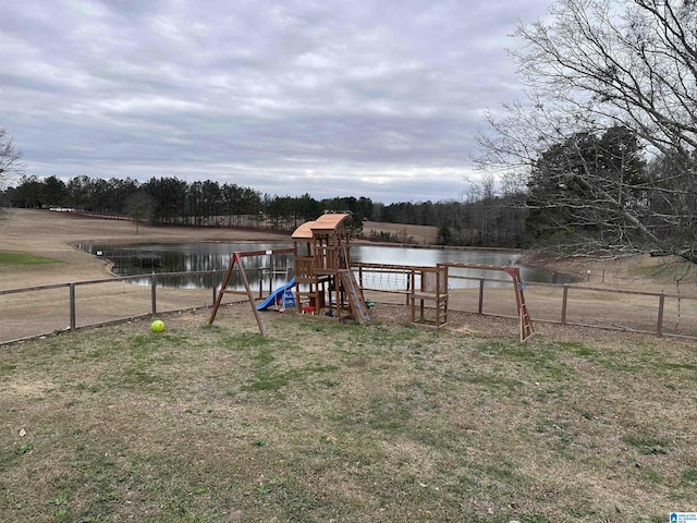 view of playground with a water view