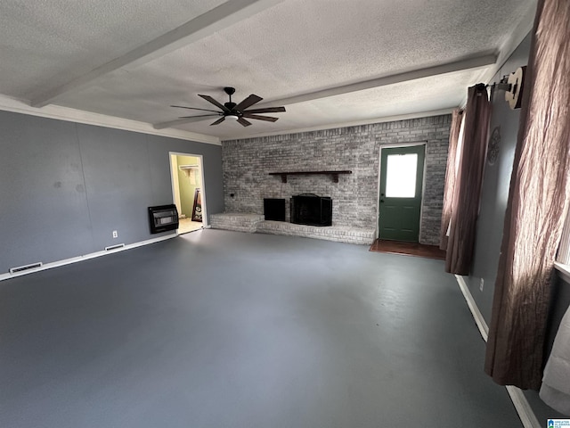 unfurnished living room with ceiling fan, concrete floors, a textured ceiling, and a fireplace