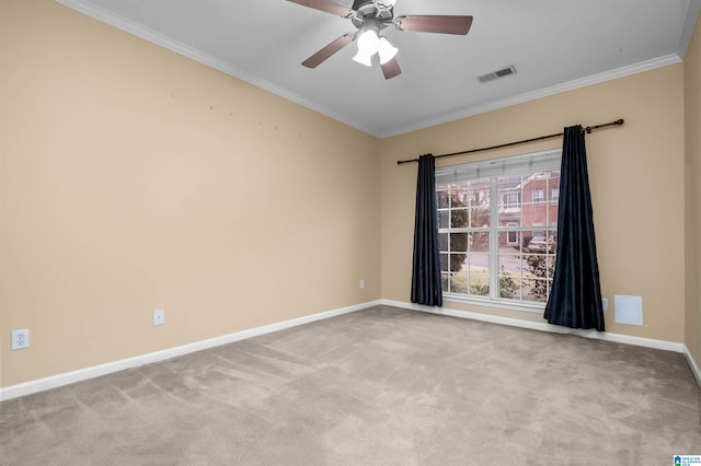 empty room with ornamental molding, light colored carpet, and ceiling fan