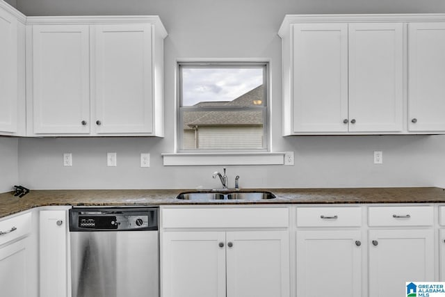 kitchen with white cabinetry, dishwasher, sink, and dark stone counters