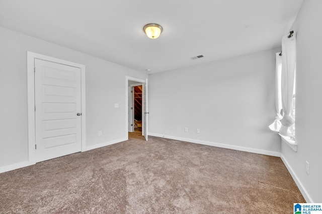 spare room featuring carpet flooring