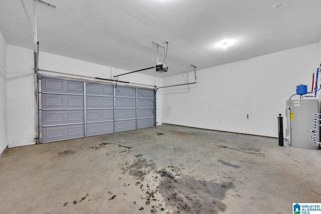 garage with a garage door opener and electric water heater