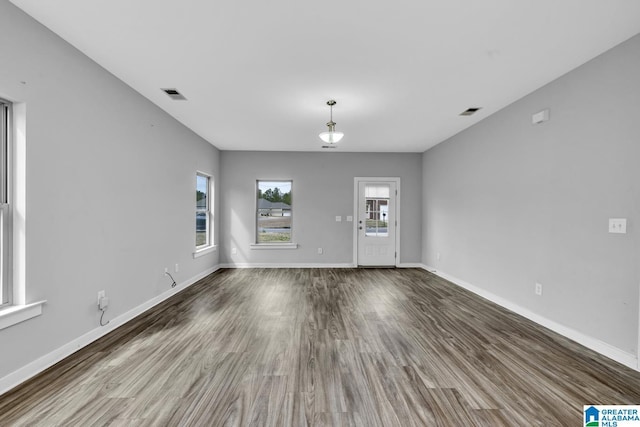 spare room with hardwood / wood-style floors