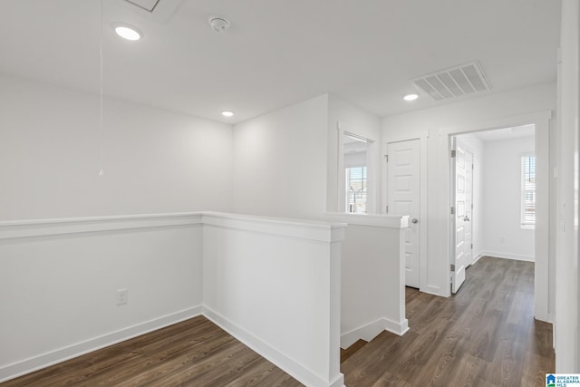 corridor featuring dark hardwood / wood-style floors