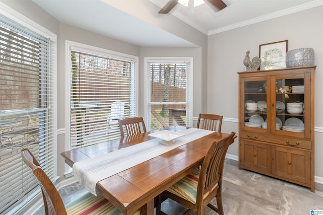 dining room featuring crown molding and ceiling fan