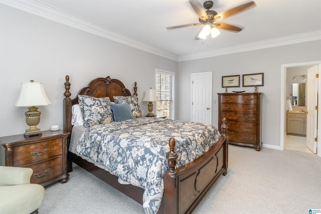 carpeted bedroom featuring ceiling fan, ornamental molding, and ensuite bathroom