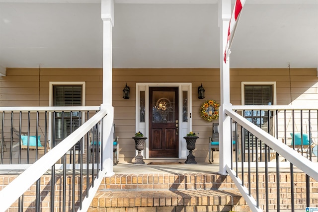 property entrance featuring covered porch