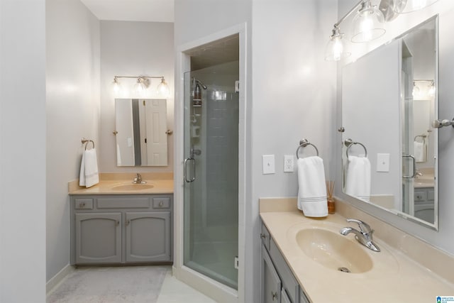 bathroom featuring walk in shower and vanity