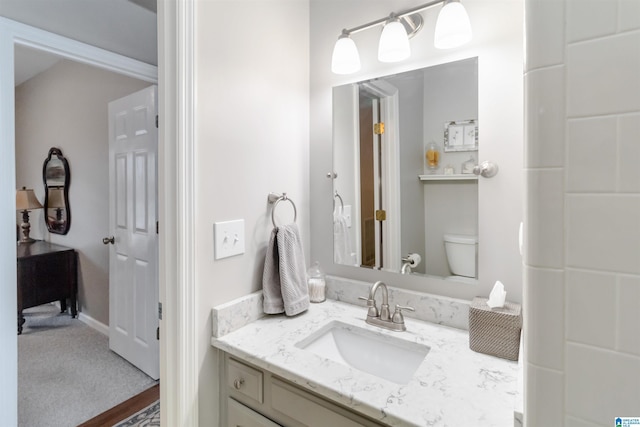 bathroom with vanity and toilet