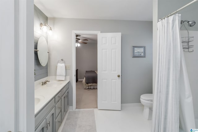 bathroom featuring vanity, a shower with curtain, tile patterned floors, and toilet