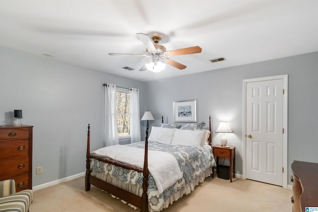 bedroom with ceiling fan and light colored carpet