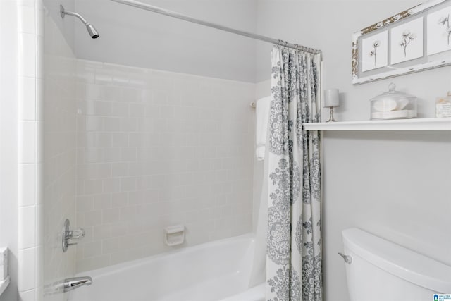 bathroom with toilet and shower / bath combo with shower curtain