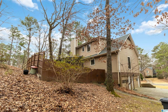 view of side of home featuring a garage