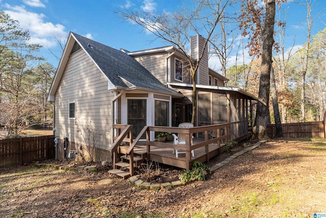 back of house featuring a deck and a sunroom