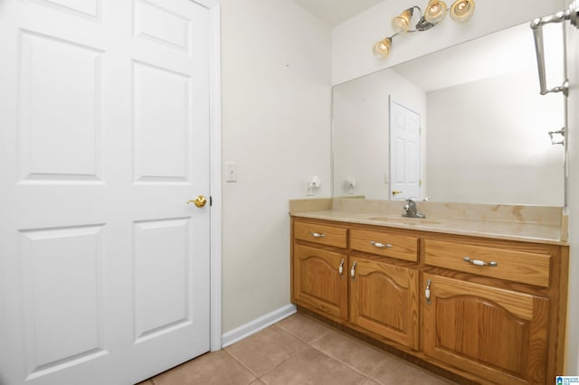 bathroom with tile patterned flooring and vanity