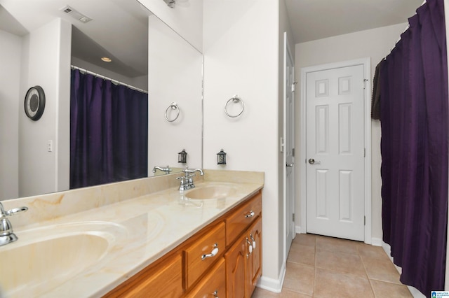 bathroom with vanity and tile patterned floors