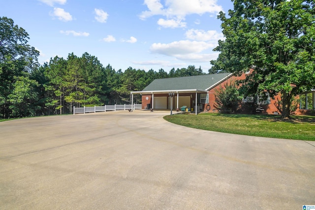 single story home with a garage and a front lawn