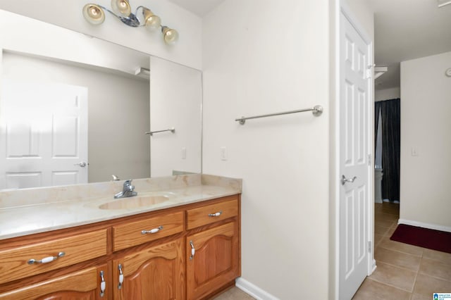 bathroom featuring vanity and tile patterned flooring