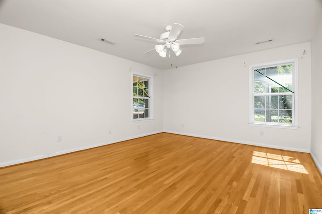 empty room featuring ceiling fan and light wood-type flooring