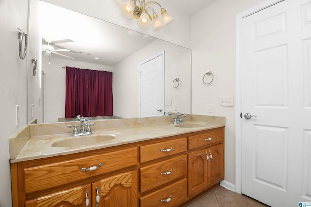 bathroom featuring ceiling fan, tile patterned floors, and vanity