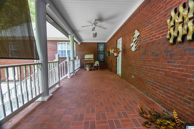 view of patio with ceiling fan and a porch