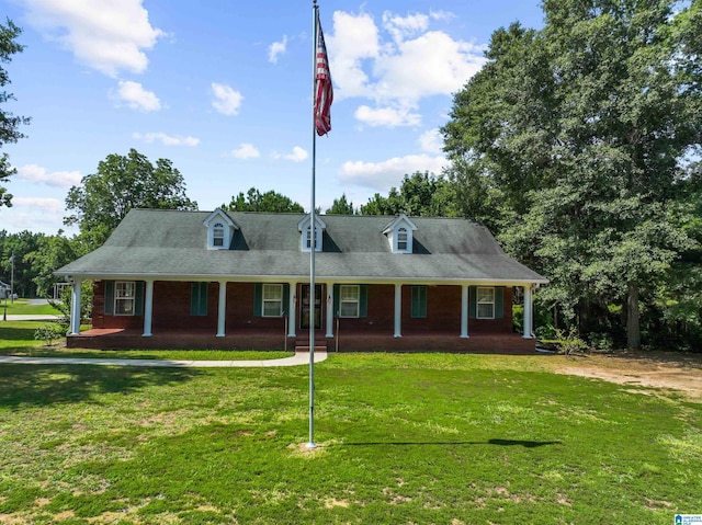 cape cod home with a porch and a front yard