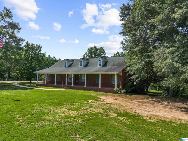 view of front of house featuring a front yard and a porch