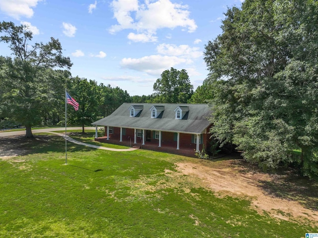 farmhouse with a front yard and a porch