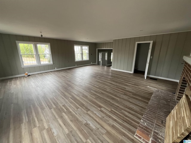 unfurnished living room with hardwood / wood-style flooring