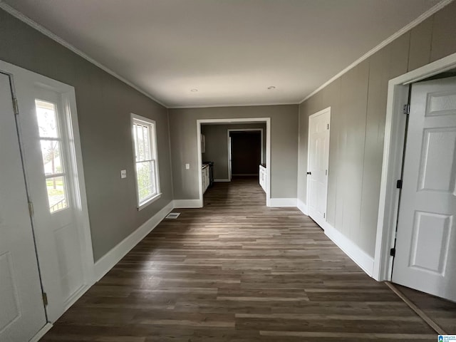 hall with crown molding and dark wood-type flooring