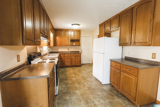 kitchen featuring sink and white appliances