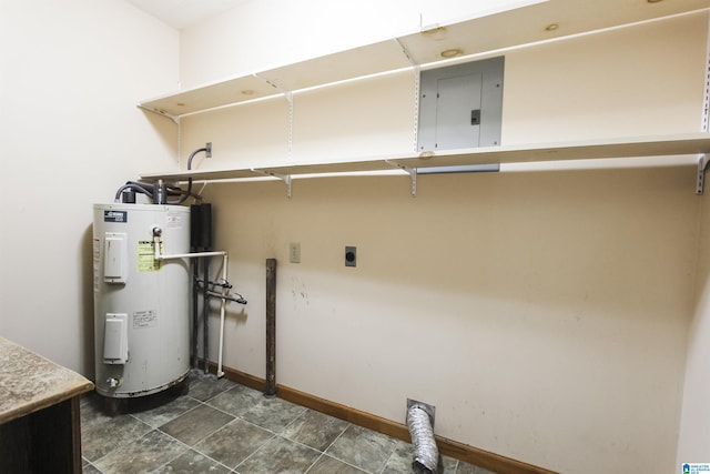 washroom with water heater, electric panel, and hookup for an electric dryer