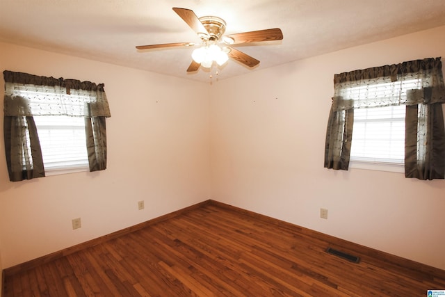 empty room featuring hardwood / wood-style flooring and ceiling fan