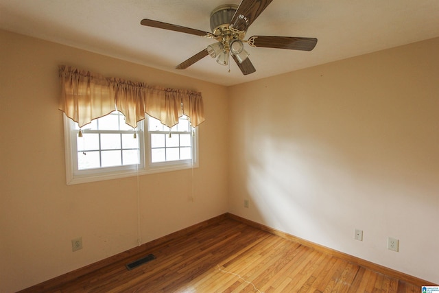 spare room with light hardwood / wood-style floors and ceiling fan