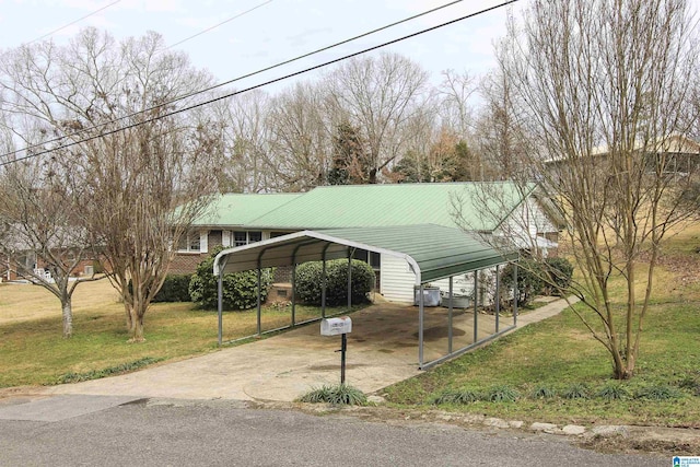 view of parking featuring a carport and a yard