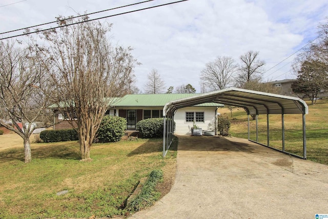 ranch-style home with a carport and a front yard