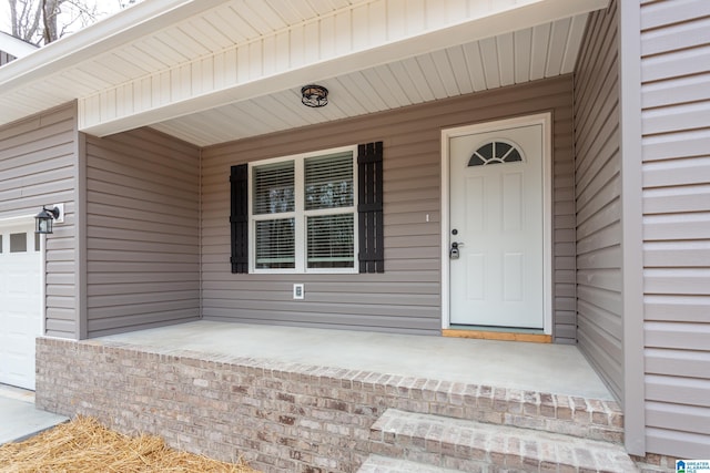 doorway to property featuring covered porch