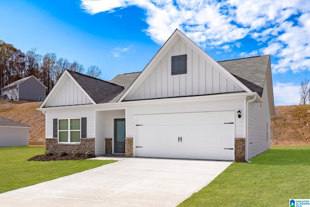 view of front facade with a garage and a front lawn