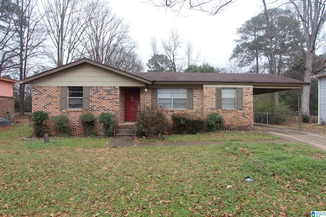 ranch-style home featuring a carport and a front lawn