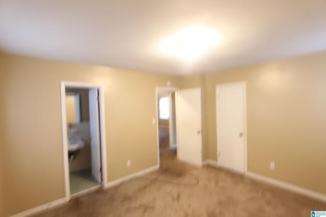 unfurnished bedroom featuring carpet and a closet