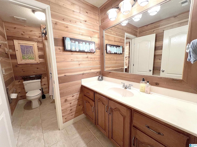 540 County Road 175, Crane Hill, AL 35053 - bathroom featuring wood walls, toilet, vanity, and tile patterned floors