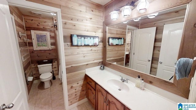 540 County Road 175, Crane Hill, AL 35053 - bathroom featuring wood walls, toilet, tile patterned flooring, and vanity