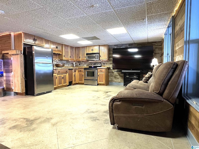 540 County Road 175, Crane Hill, AL 35053 - kitchen featuring appliances with stainless steel finishes, open floor plan, light countertops, concrete floors, and brown cabinetry