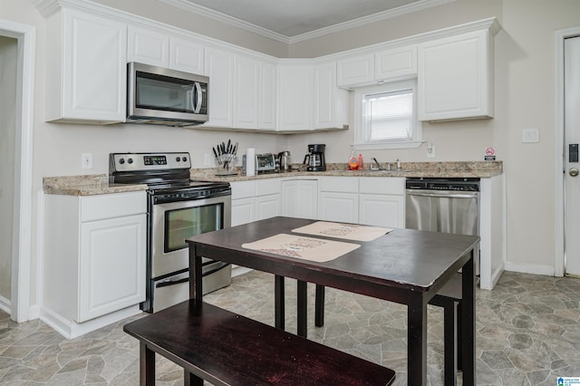 kitchen featuring sink, crown molding, white cabinetry, stainless steel appliances, and light stone counters