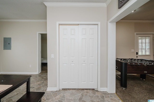 interior space with ornamental molding and electric panel