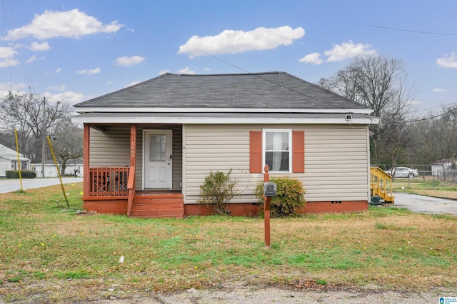 bungalow-style house with a front lawn